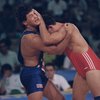 Prior to becoming a UFC middleweight, Dan Henderson, left, wrestles against Switzerland's David Martinetti during the 1992 Barcelona Summer Olympics. Henderson is just one of many former wrestlers to turn to the UFC following their wrestling careers.

