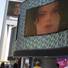 People watch live television news coverage of the Michael Jackson memorial outside Planet Hollywood on Tuesday.