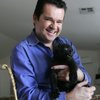 Dirk Arthur holds Jan, a 10-week-old leopard to be added to his magic show.