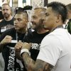 Lorenzo Fertitta, middle, poses for photos with fans at the UFC Fan Expo Friday inside the Mandalay Bay Convention Center.