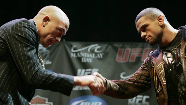 Georges St. Pierre, left, and Thiago Alves bow and shake hands after squaring off at a news conference for UFC 100 at Mandalay Bay Thursday, July 9, 2009. UFC 100 takes place Saturday, July 11th at the Mandalay Bay Events Center. 