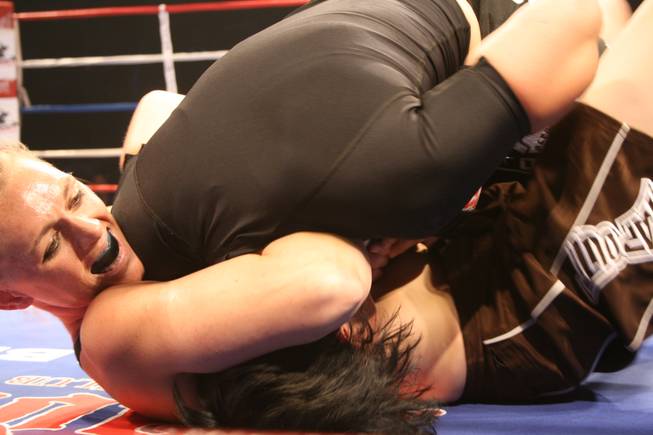Holly Dixon gets a choke in on Autumn Richardson at Tuff Girls.