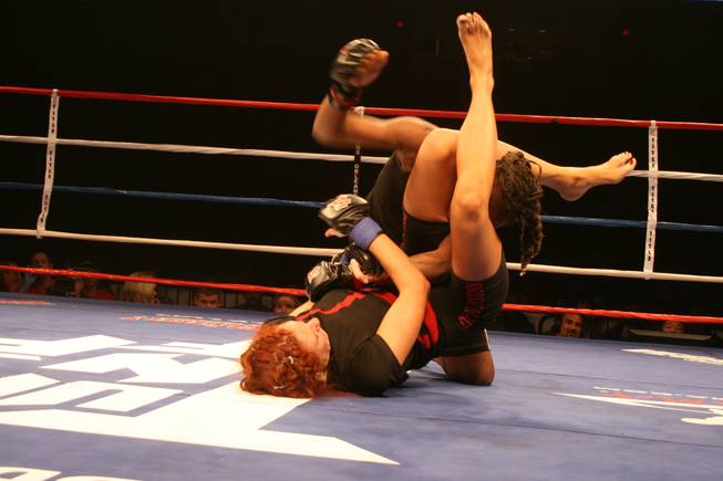 Amanda LaVoy defends against MaEisha Lowe (above) at Tuff Girls.