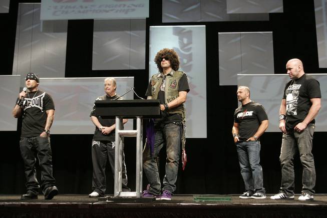 TapouT co-founder Dan "Punkass" Caldwell, left, speaks as recently deceased Tapout co-founder Charles "Mask" Lewis Jr. is inducted into the UFC Hall of Fame Friday, July 10, 2009.