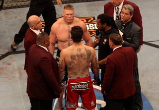 Brock Lesnar and Frank Mir meet just before their heavyweight title fight at UFC 100 at Mandalay Bay. Lesnar won with stoppage in the second round.