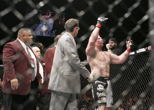 Brock Lesnar flips off the audience after beating Frank Mir in their heavyweight title fight at UFC 100. Lesnar won with stoppage in the second round.