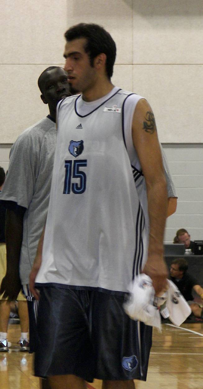 Hamed Haddadi, the first Iranian to play in the NBA, leaves a Memphis huddle Sunday at the Summer League at Cox Pavilion. 