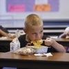 Kindergarten student Jeremy Smith, center, eats breakfast last week at Cortez Elementary School. The Clark County School Board on Thursday put off raising prices for most meals by 25 cents, but a request was made to add the item to the agenda for the board's next meeting. With the hike, Jeremy's breakfast would cost $1.25.