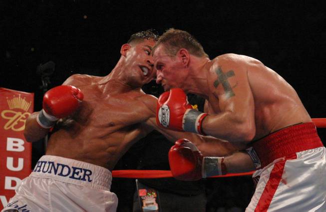 Arturo Gatti, left punches Micky Ward during the junior welterweight fight in Atlantic City, N.J. Saturday, June 7, 2003. The fight lasted the the full 10 rounds and Gatti defeated Ward by a unanimous decision This was the third fight between the fighters.