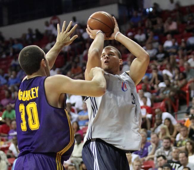 Los Angeles Clippers forward Blake Griffin takes a shot over Lakers forward Ben McCauley during Monday's 93-82 Clippers victory at the NBA summer league. Griffin's much anticipated first week of pro ball will conclude on Sunday at 7:30 p.m. with a showdown against Phoenix and older brother Taylor.