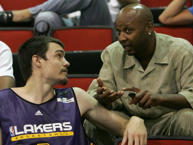 Adam Morrison of the Los Angeles Lakers (left) talks with Lakers assistant coach Brian Shaw at the NBA Summer League in the Cox Pavilion.

