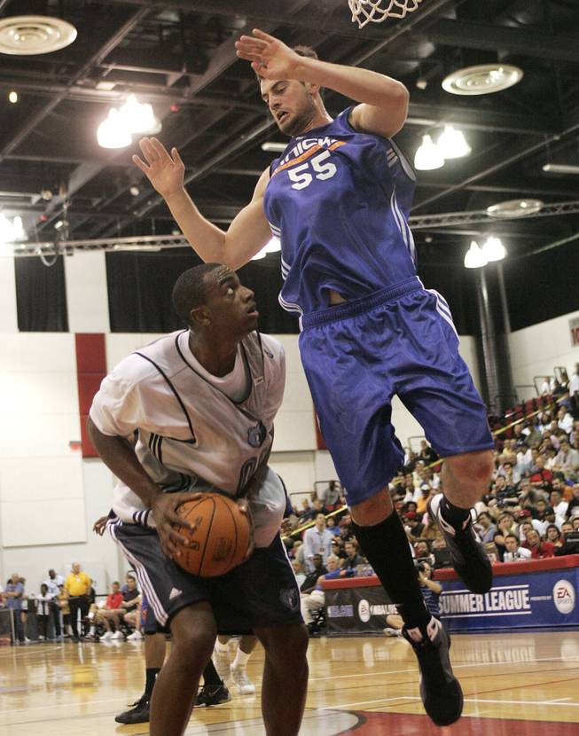 New York Knicks forward Nikoloz Tskitishvili goes up to defend a shot by Memphis forward Darrell Arthur during NBA Summer League action on Tuesday afternoon at Cox Pavilion. Tskitishvili had 12 points and 4 rebounds in his 2009 summer league debut, as the Knicks defeated the Grizzlies, 90-86.