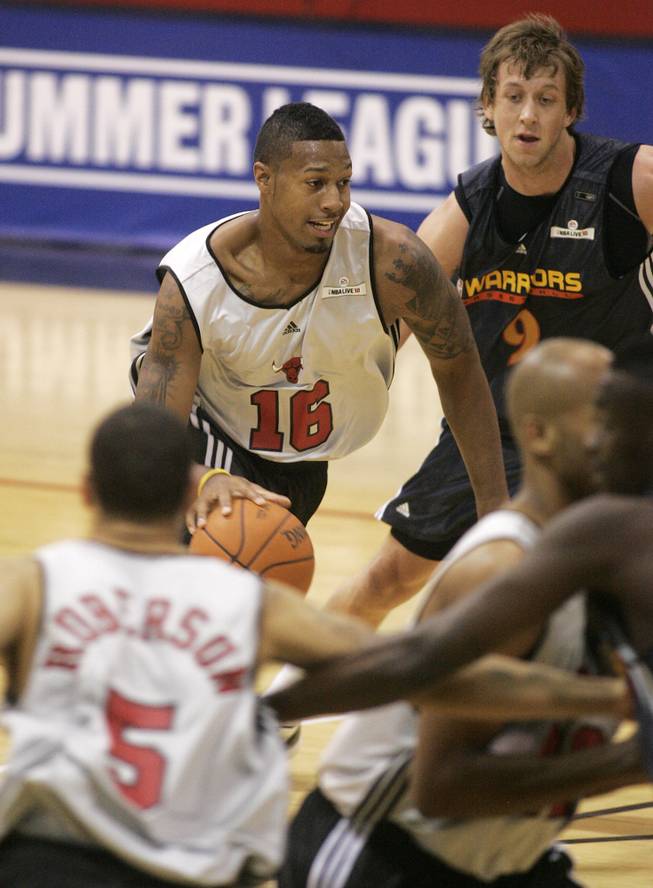 Chicago forward James Johnson drives through the heart of the Golden State defense during the Bulls' 95-83 loss on Tuesday afternoon in NBA summer league play. The first-round pick out of Wake Forest scored 21 points and grabbed 8 rebounds in his pro debut at Cox Pavilion.