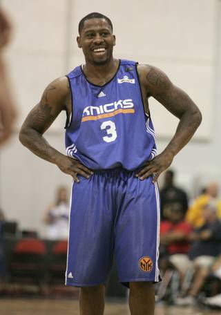 Former UNLV standout Wink Adams handles the ball as a member of the New York Knicks during the NBA's Summer League Wednesday, July 15, 2009. 