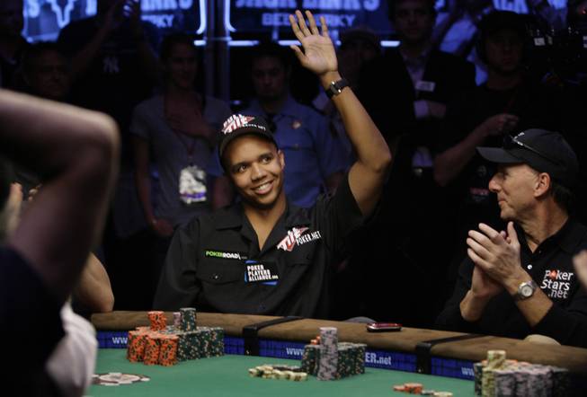 Phil Ivey waves to supporters after finishing in the final nine at the World Series of Poker at the Rio Hotel and Casino in Las Vegas on Wednesday, July 15, 2009.