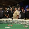 Players who made the final table of the World Series of Poker pose for a photograph at the Rio Hotel and Casino in Las Vegas on Wednesday, July 15, 2009. They are from left, James Akenhead, Jeff Shulman, Phil Ivey, Antoine Saout, Darvin Moon, Joseph Cada, Steven Begleiter, Kevin Schaffel and Eric Buchman.