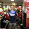 Tony Hsieh, CEO of Zappos, takes a break with employees in the merchandising department for athletic performance footwear to enjoy a game of desk volleyball at the company's call center in Henderson in this file photo.