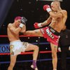 Kevin Ross lands a kick to the body of Justin Greskiewicz at World Championship Muay Thai inside the