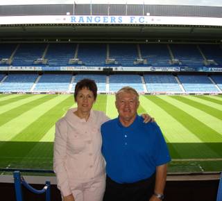 John and Marjory Kennedy pose at Ibrox Stadium, home of Rangers Football Club, in Glasgow, Scotland.