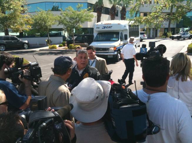 Michael Flanagan, a special agent with the Drug Enforcement Agency's Nevada office, addresses the media Tuesday outside the Las Vegas office of Dr. Conrad Murray. Law enforcement agencies have executed search warrants on Murray's home and office in connection with the death of singer Michael Jackson.