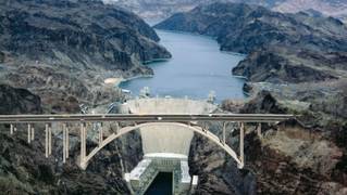 A computer rendering of the completed bridge against the Hoover Dam.