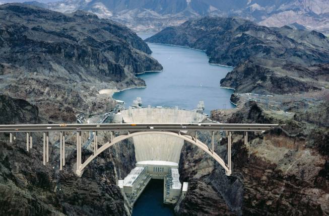 A computer rendering of the completed bridge against the Hoover Dam.