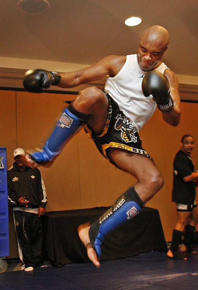 Fighters with the Ultimate Fight Championship hold workouts at the Loews Hotel in Center City Philadelphia on Wednesday afternoon August 5, 2009. Pictured is Anderson Silva, a light heavyweight fighting out of Curitiba, Brazil. He is shown flying through the air as attempts to kick a heavy bag.