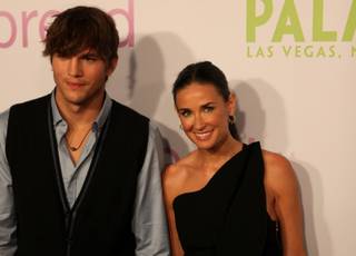 Ashton Kutcher and wife Demi Moore walk the red carpet at the premiere of Kutcher's new movie 