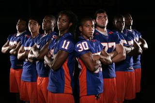 The Bishop Gorman High football team is expected to have eight sign national letters of intent to play college football. They included, from left, Geoffrey Gibson (Cal), Evan Palelei (Navy), Alex Turner (Stanford), Taylor Spencer (UNLV), Victor Belen (Samford), Tim Gulley (uncommitted), Jalen Grimble (a junior with multiple offers) and Xavier Grimble (USC). Not pictured are Tim Wilkinson (Northern Arizona) and Ian Bobak (UNLV).
