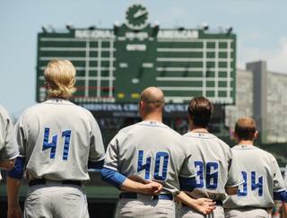 Las Vegas 51s players, from left, Rommie Lewis, Brian Wolfe, Dirk Hayhurst and Bill Murphy stand at attention for 