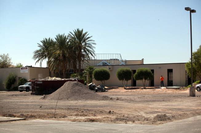 Workers renovate the Church of Scientology's future home in August near Emerson and Eastern avenues. The church in October 2005 purchased the 3.71-acre parcel for $2.9 million from a synagogue that has since moved to Henderson, according to county records.