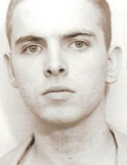 The Aryan Warriors' reputed leader in Nevada, Ronald "Joey" Sellers (shown in his 1991 booking mug), is serving a life sentence.