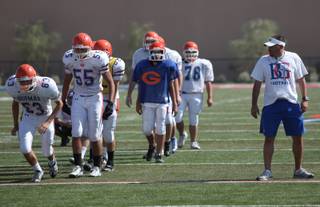 A look at Bishop Gorman High first-year football coach Tony Sanchez at practice Tuesday at Fertitta Field in Las Vegas.