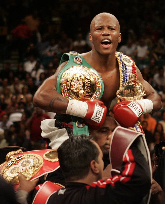 Zab Judah, of New York, wears the WBA, WBC and IBF belts as he celebrates defeating Cosme Rivera, of Los Angeles, in their undisputed welterweight championship bout on Saturday, May 14, 2005, at the MGM Grand Garden Arena. Judah will be fighting Antonio Diaz in a 144-pound bout on the undercard to Mayweather-Marquez on Sept. 19.