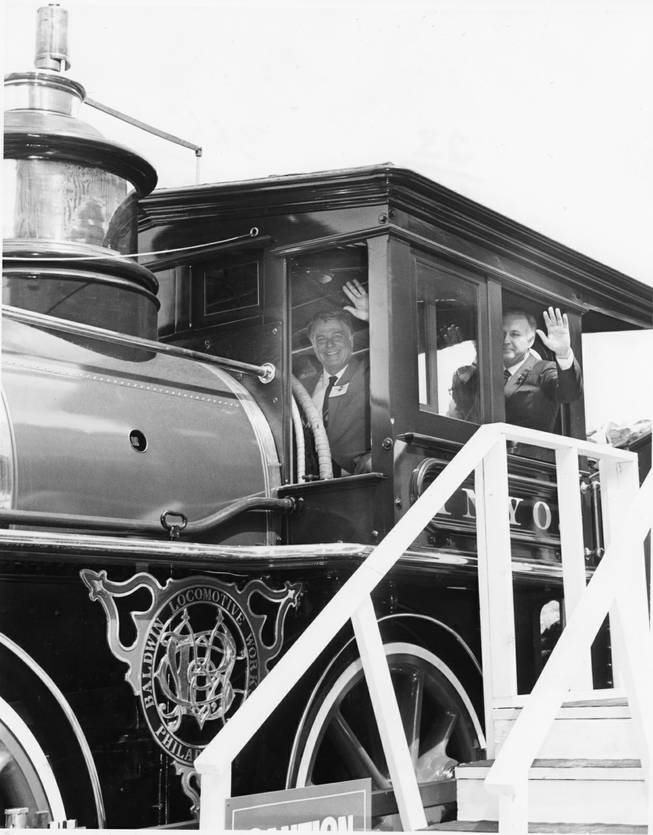 Mayor Bill Briare, left, and Palace Station owner Frank Fertitta Jr. wave to the crowd aboard the 1875 vintage steam locomotive at the Palace Station grand opening on April 6, 1984. 