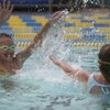 Sisters Sabrina Snow, 10, and Erica Snow, 9, right, splash it out while having a water fight Saturday on closing day at Boulder City Pool.