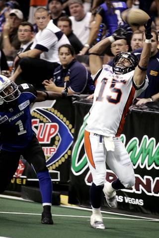 Raul Vijil of the Spokane Shock catches a ball for a touchdown as Micheaux Robinson of the Wilkes-Barre/Scranton Pioneers defends at the 2009 ArenaCup Championship at The Orleans Arena on Saturday,. Spokane took the title with a score of 74-27.