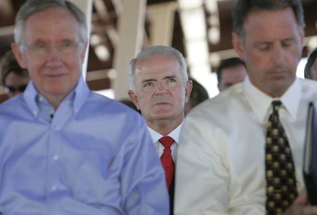 Nevada Governor Jim Gibbons, center, listens to speakers behind Senate ...
