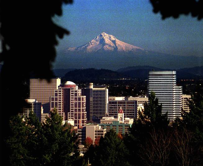 Picturesque Mt. Hood looms over downtown Portland, Ore., as seen from Washington Park Rose Garden in the city's west hills.