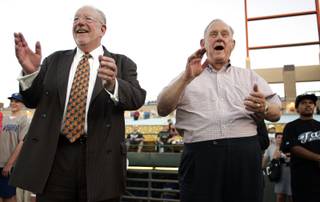Las Vegas Mayor Oscar Goodman and Reno Mayor Bob Cashell watch the first ceremonial pitches being thrown out before the Las Vegas 51s and Reno Aces game at Cashman Field in Las Vegas on Wednesday.