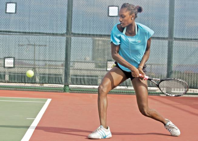 Asia Muhammad, a Henderson native and former Coronado student, is seen here practicing at the Las Vegas Hilton tennis complex in February. Muhammad recently turned pro and is currently competing in the qualifying draw of the US Open in New York City.