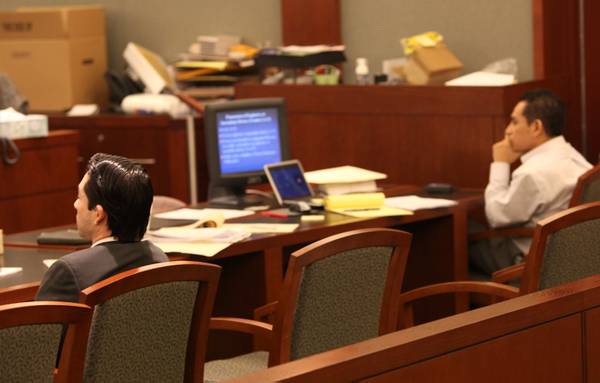 Porfirio Duarte-Hererra (left) and Omar Rueda-Denvers listen Thursday during closing ...