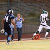 Green Valley running back Treveece Jackson outruns Centennial linebacker David Waihenya to score the only touchdown for Green Valley Friday night at Centennial High School.  Green Valley edged out a win 10-7.