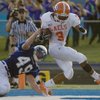 Bishop Gorman halfback Shaquille Powell scampers into the end zone for a touchdown past an attempted tackle from Dixie's Phillip Cooper Friday in St. George, Utah.