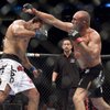 Antonio Nogueira, left, slips a punch thrown by Randy Couture in their fight at UFC 102 mixed martial arts match on Saturday Aug. 29, 2009 at the Rose Garden in Portland, Ore. Nogueira won the match by unanimous decision.