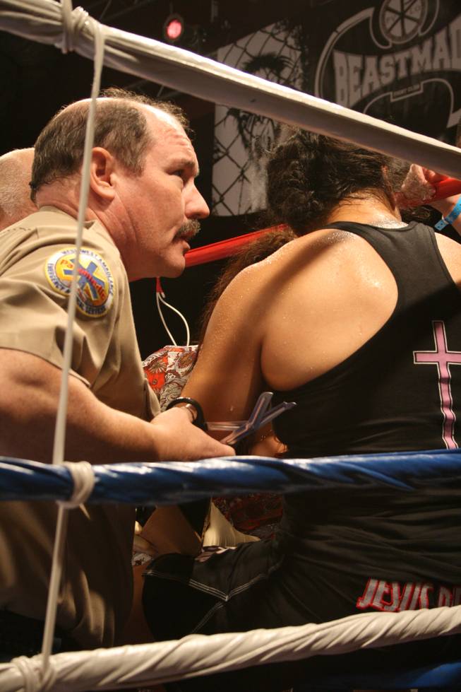 Medics and the ringside doctor tend to Moa Palmer's injured arm after Bobbi-Jo Dalziel defeated her at Tuff-N-Uff: USA vs. Canada. 