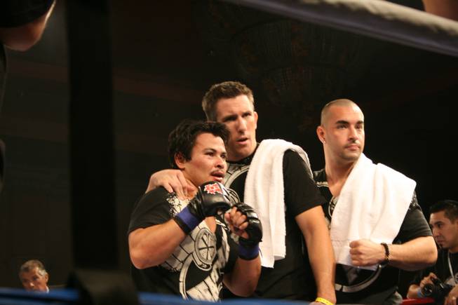 Mark Pham poses with his corner before the decision is announced. He lost to Gor Mnatsakanyan in a unanimous decision. 