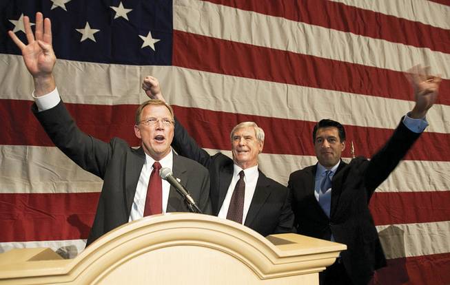 Rep. Jon Porter, from left, Gov. Kenny Guinn and Attorney General Brian Sandoval chant "four more years" at Mandalay Bay after announcing on Election Night 2004 that George Bush won Nevada. Sandoval was chairman of the Bush-Cheney Nevada Leadership Team.