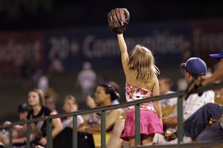 A 51s fan hopes for a foul ball as the team heads to the dugout during a game against the Reno Aces at Cashman Field in Las Vegas on Sunday, Aug. 30, 2009. 