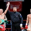 Las Vegas resident Kevin Ross raises his arms in victory after defeating China's Kang En for the WBC